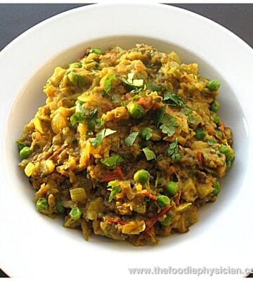 Bangain bharta in a white bowl.