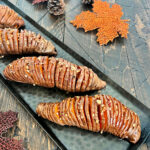 Hasselback sweet potatoes on a tray