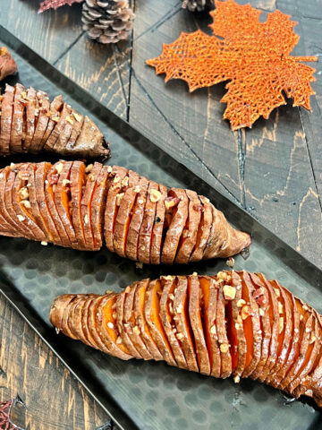 Hasselback sweet potatoes on a tray