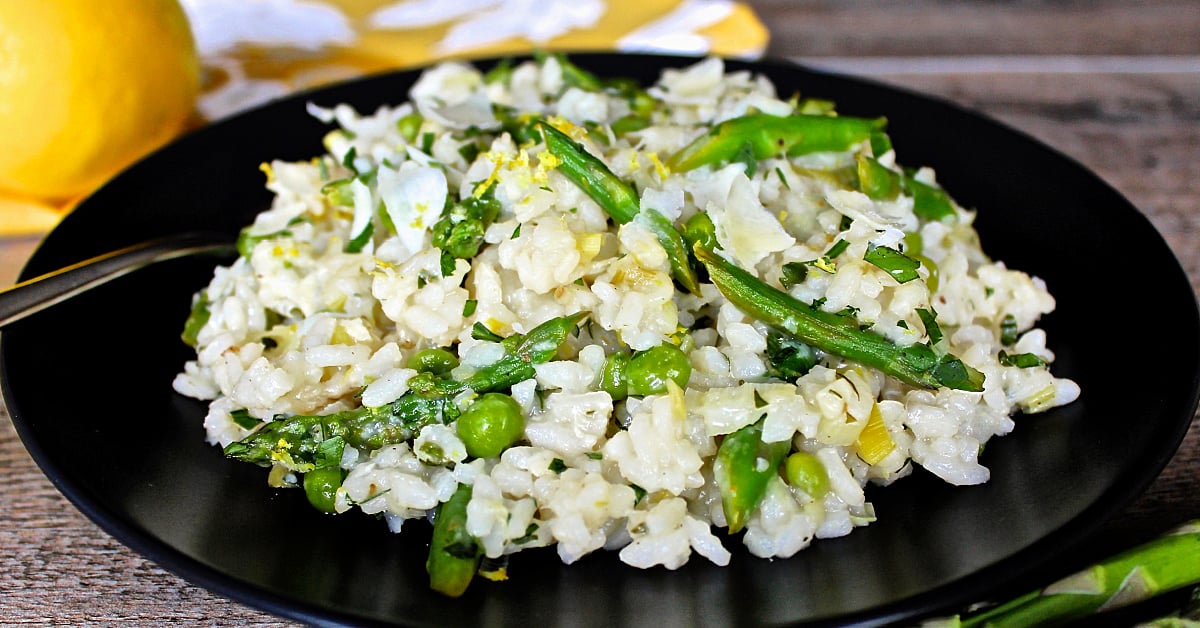 lemon risotto on black plate side view