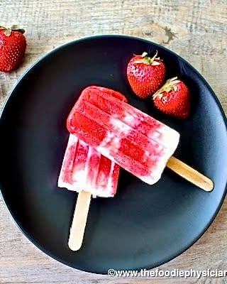 popsicles on a black plate