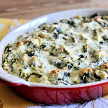 Healthy spinach artichoke dip in red casserole dish