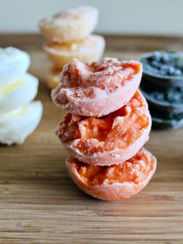 Stacks of different flavors of frozen homemade baby food