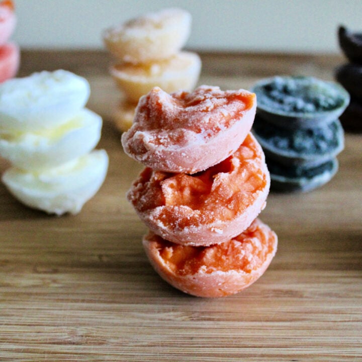 Stacks of different flavors of frozen homemade baby food