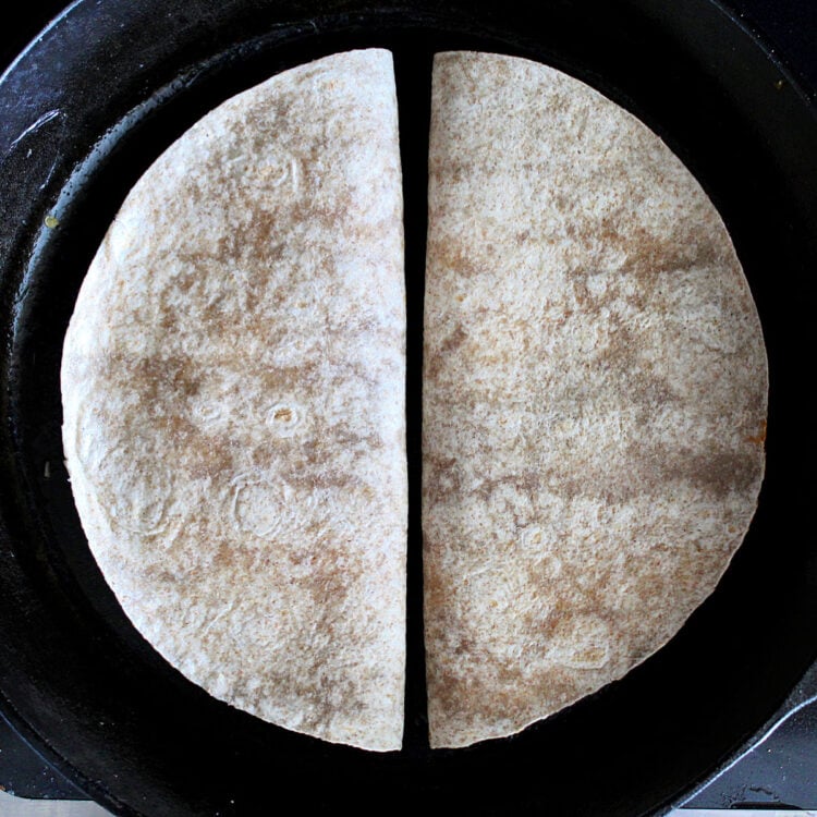 pulled chicken quesadillas in a skillet