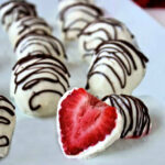 Yogurt dipped strawberries with a chocolate drizzle.