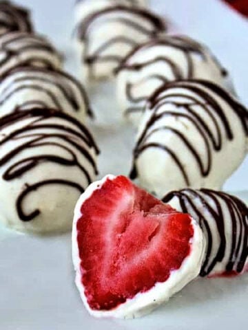 Yogurt dipped strawberries with a chocolate drizzle.