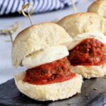 Row of meatball sliders with whipped ricotta