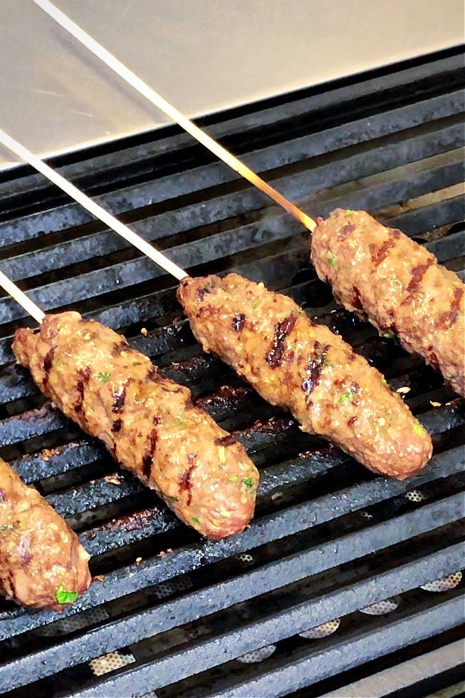 kebabs cooking on the grill