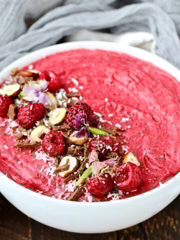 Raspberry Coconut Smoothie Bowl in white bowl.