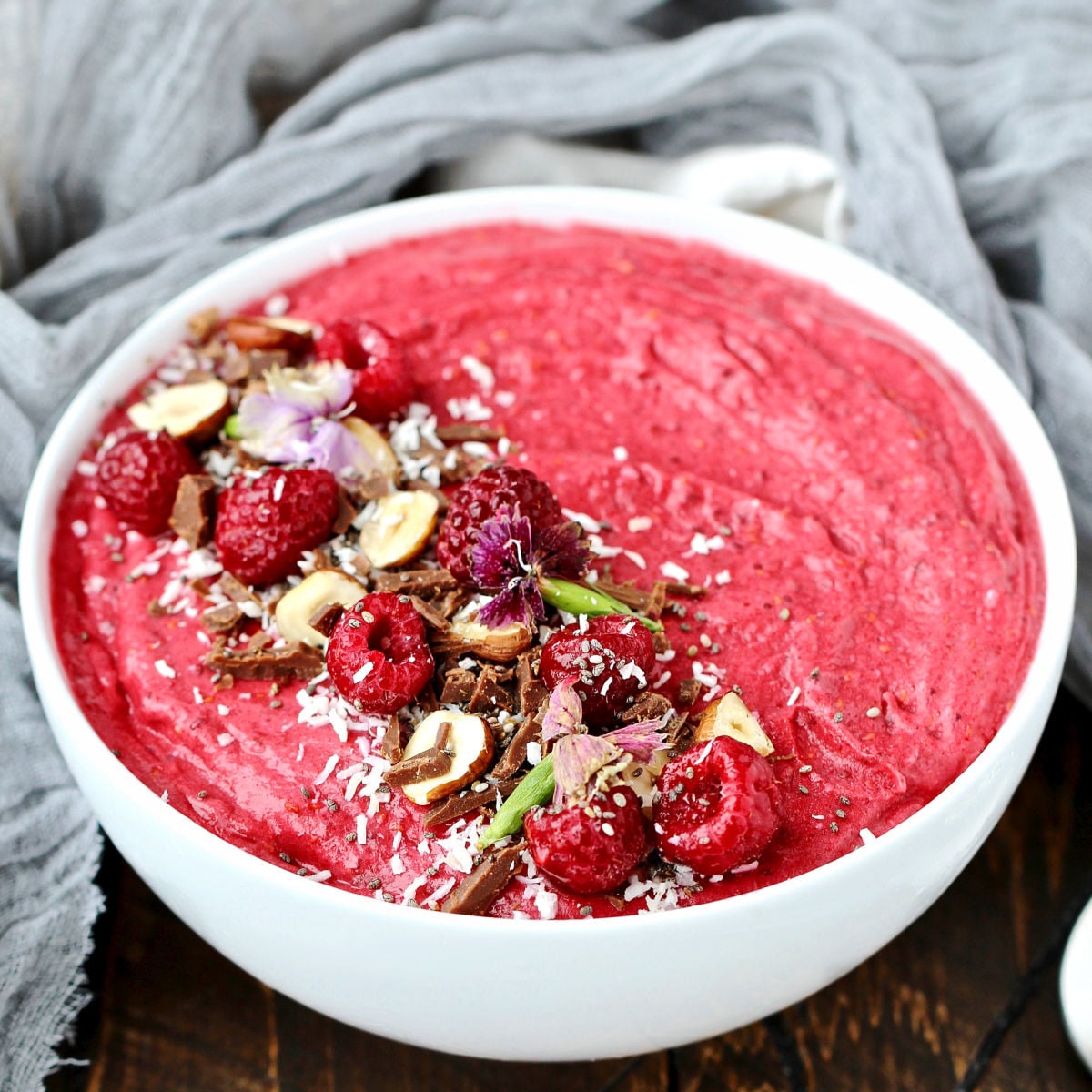 Raspberry Coconut Smoothie Bowl in white bowl.