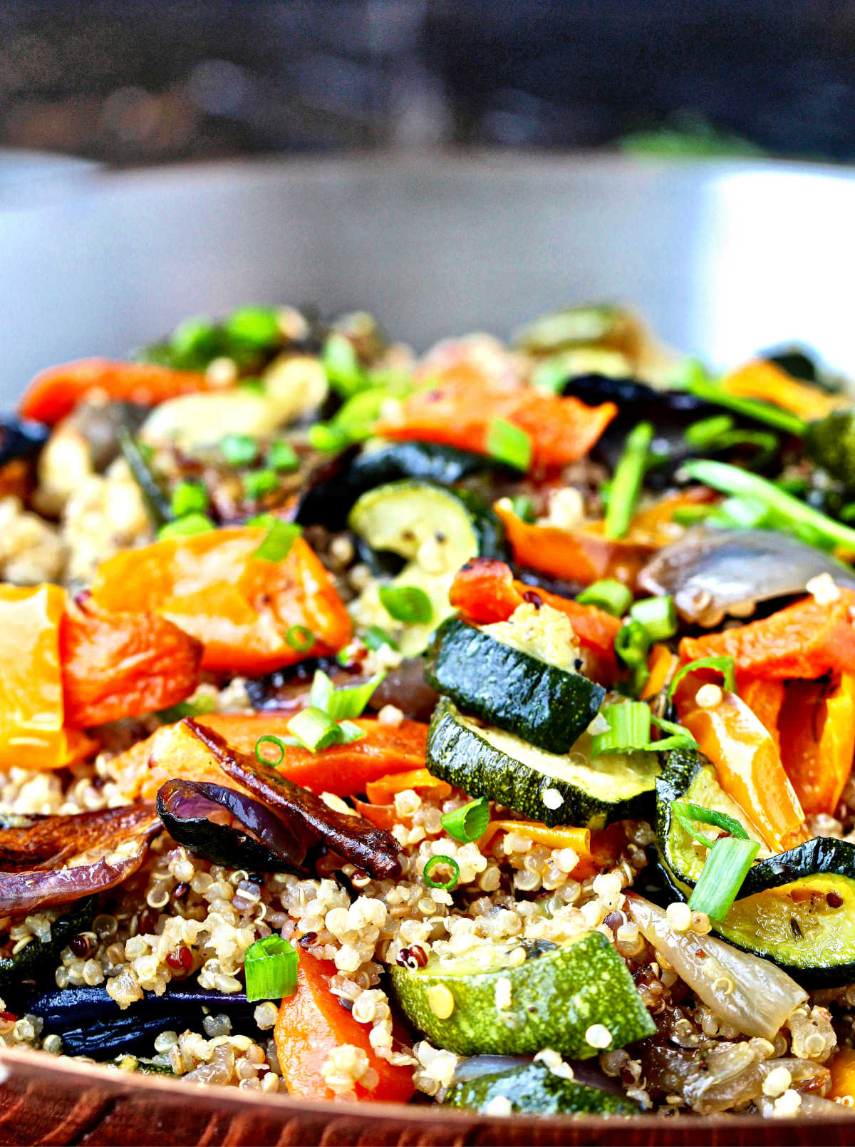 quinoa with roasted vegetables in a pan.
