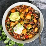 Overhead photo of Butternut Squash & Turkey Chili in a white bowl.