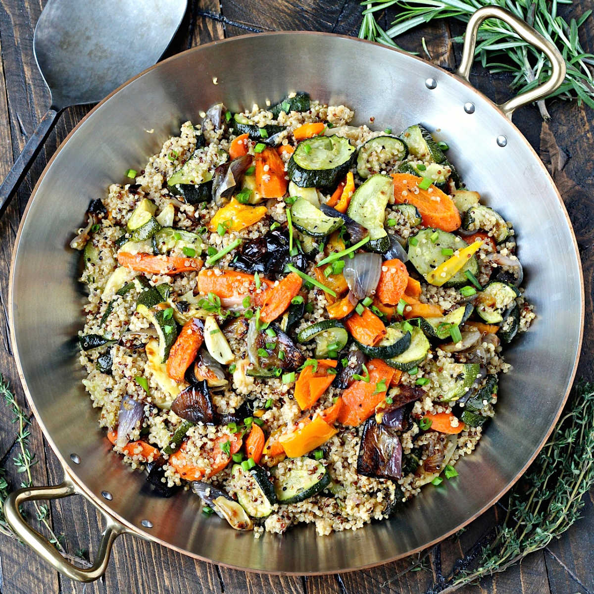 overhead quinoa with roasted vegetables in a pan.