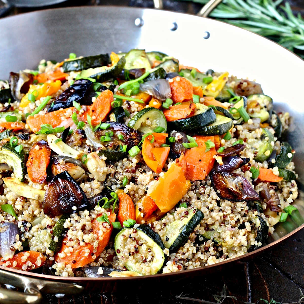 quinoa with roasted vegetables in a pan