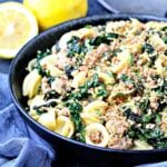 Orecchiette with Kale, Turkey Sausage and Gremolata Breadcrumbs in a black bowl.