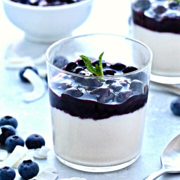 Coconut Panna Cotta with Blueberry Sauce in a glass