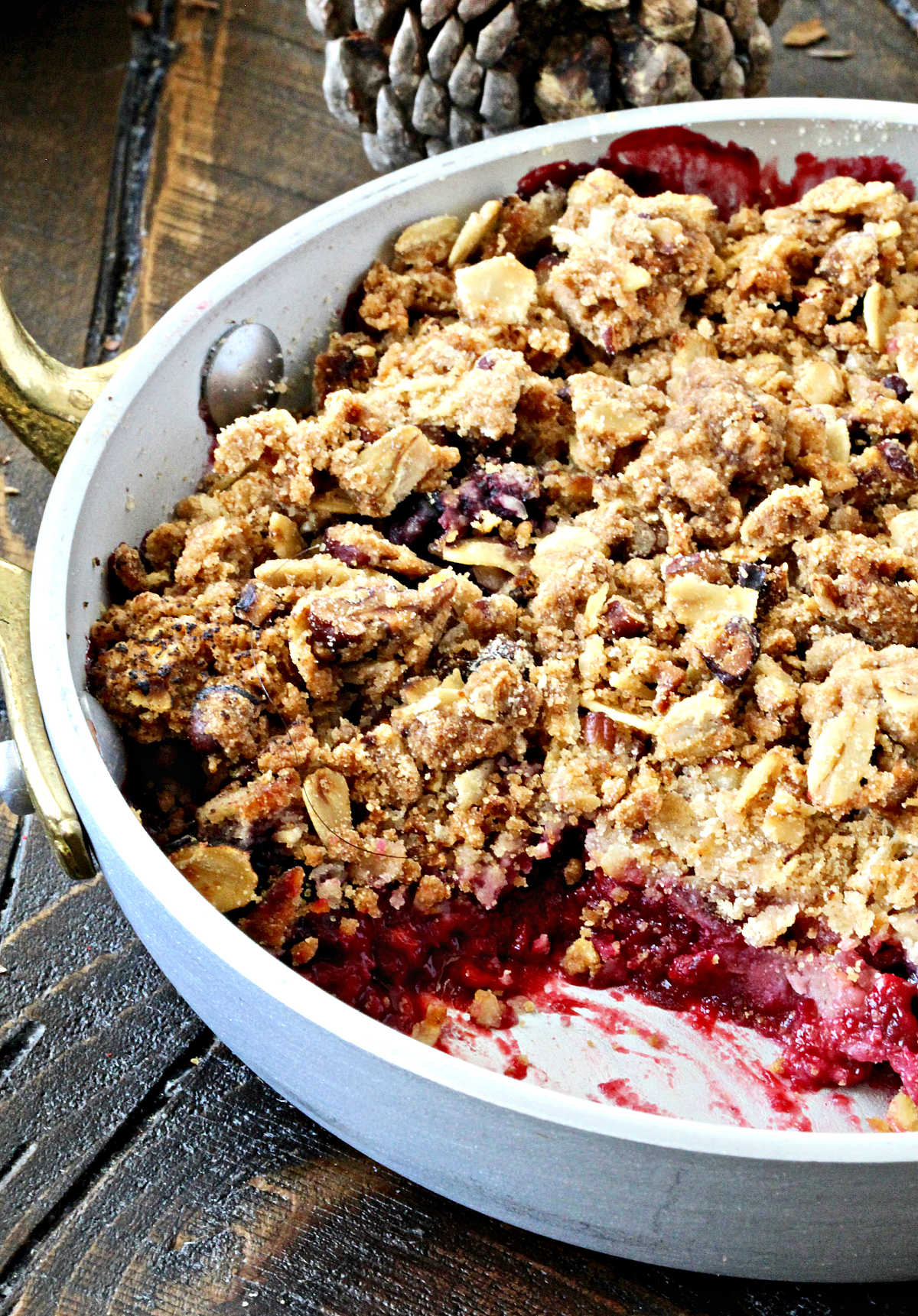 Berry crisp with a spoonful scooped out
