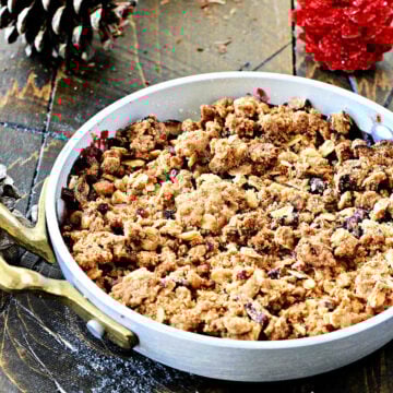Berry crisp in individual metal serving dish