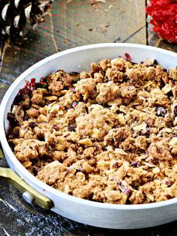 Berry crisp in individual metal serving dish
