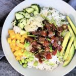 Overhead picture of a Spicy Tuna Poke Bowl in a white bowl.