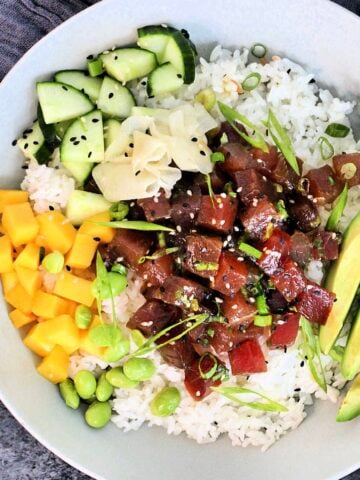 Overhead picture of a Spicy Tuna Poke Bowl in a white bowl.