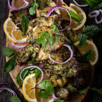 grilled chicken hariyali on a wooden board