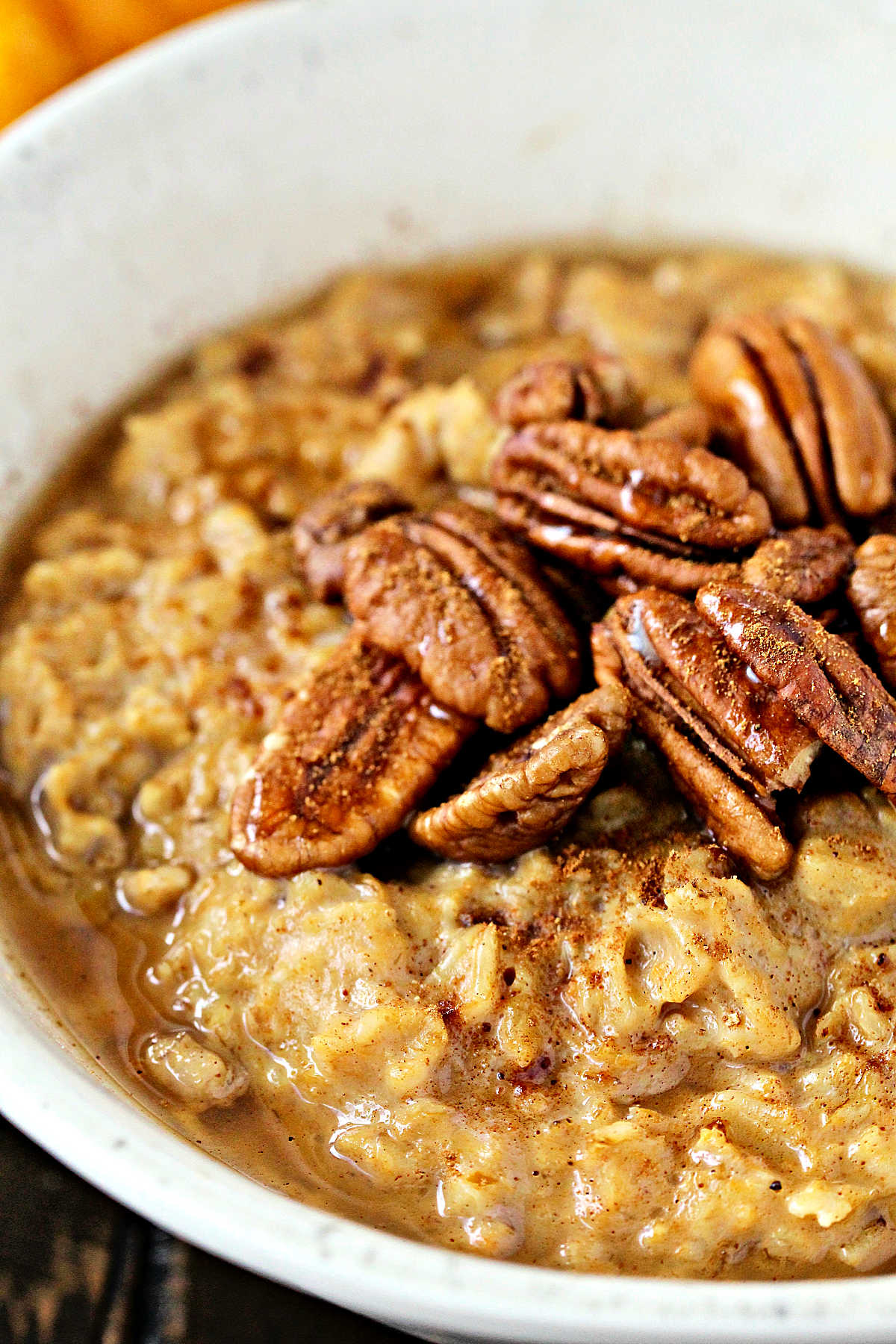 Close up of Pumpkin Spice Oatmeal in a white bowl.