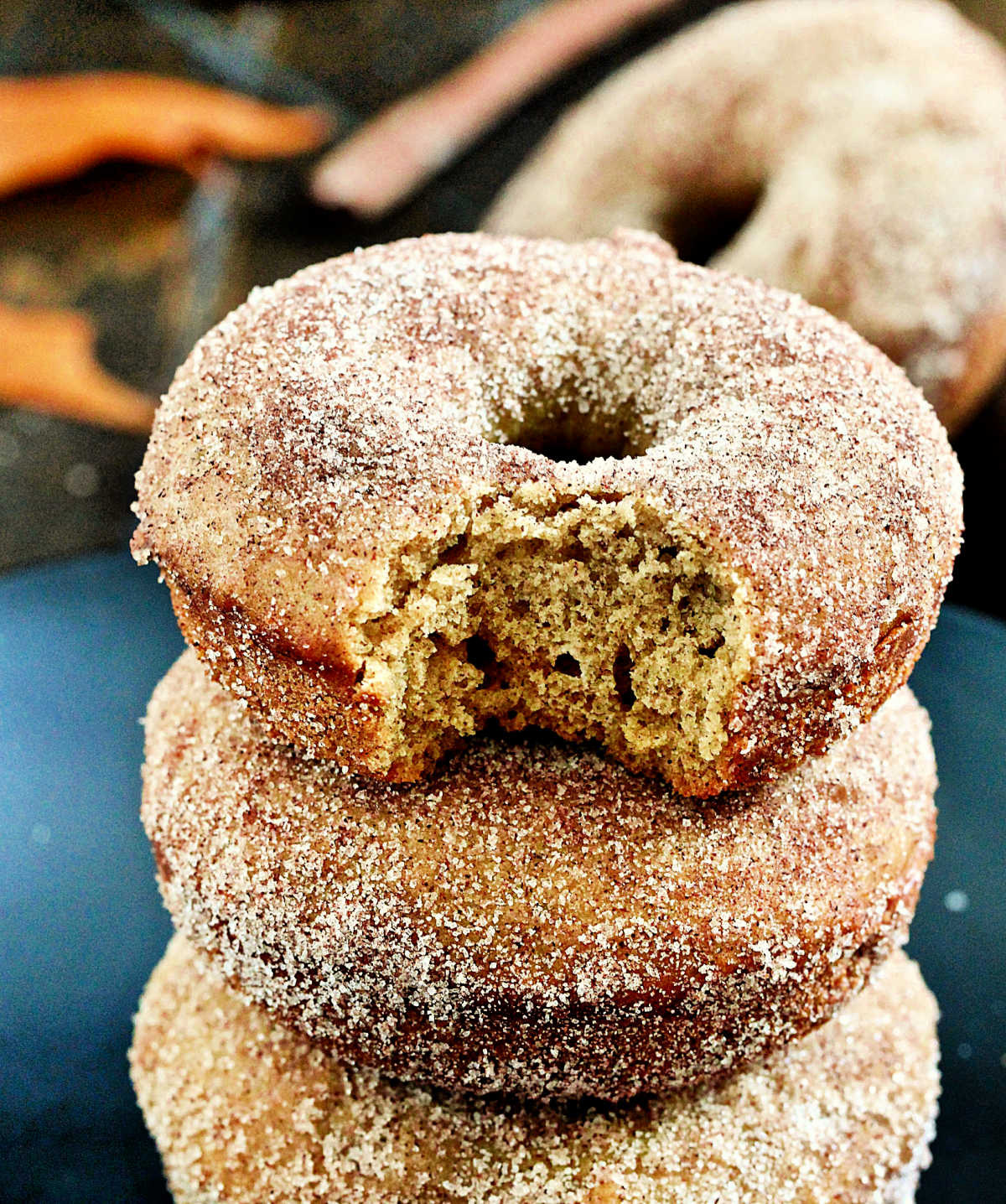 Stack of apple cider donuts missing a bite
