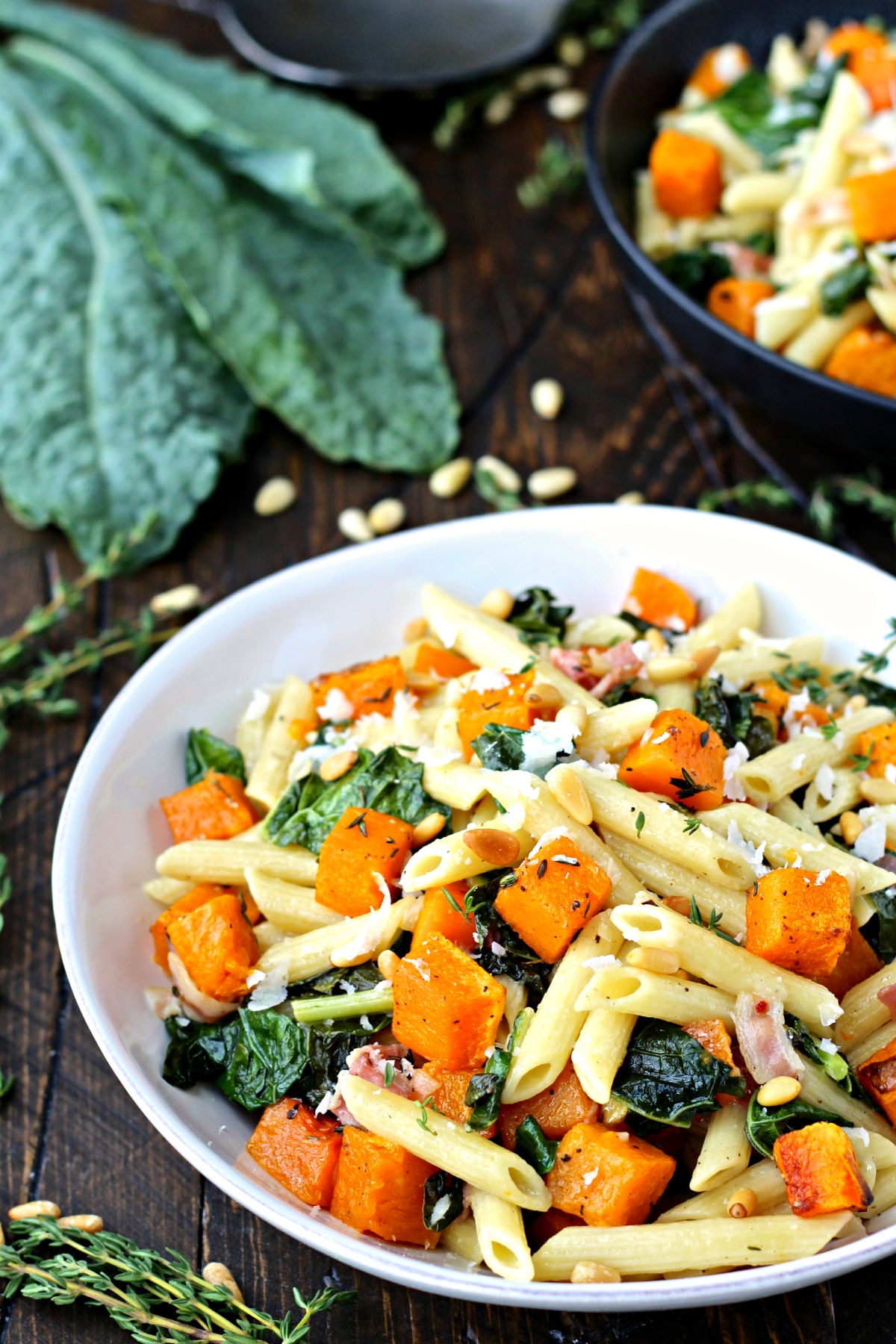 Roasted Butternut Squash Pasta with Kale in white bowl.