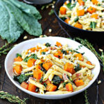 Roasted Butternut Squash Pasta with Kale in white bowl.