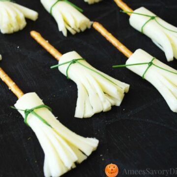 Witches broomsticks on a black background.