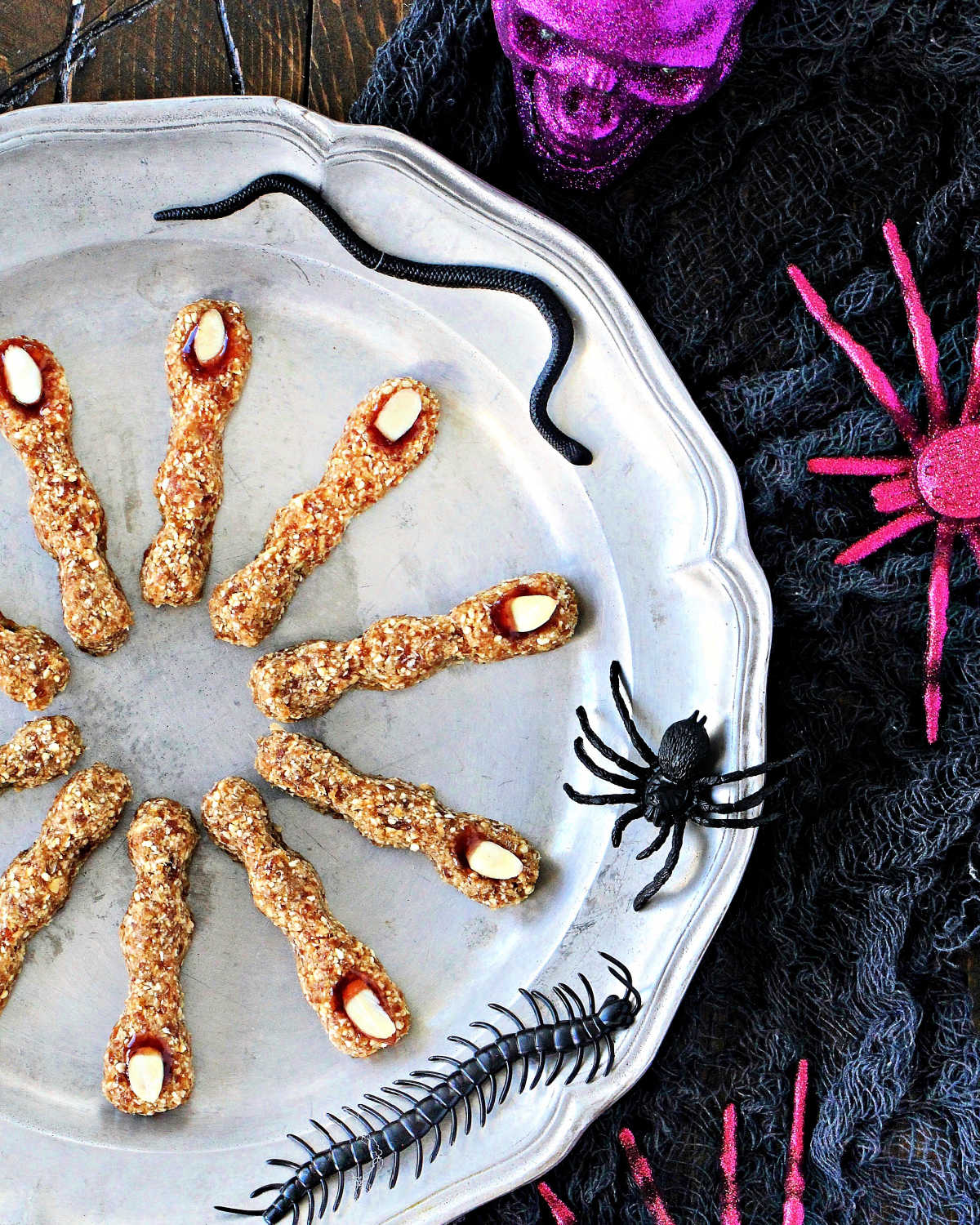 Spooky Witches' Fingers on a silver plate with decorative creepy crawlers.
