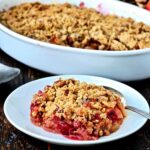 Piece of Apple cranberry crisp on a white dish