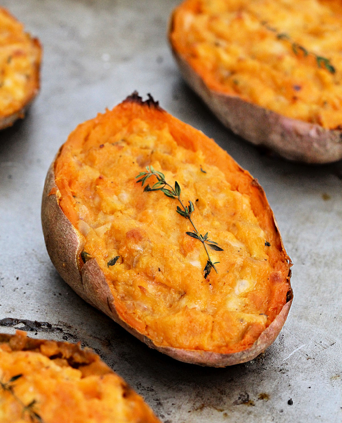 Close up of a twice baked sweet potato on a sheet pan.