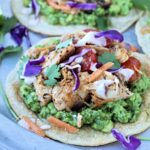 Tuna tostadas on a silver plate.