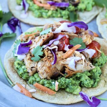 Tuna tostadas on a silver plate.