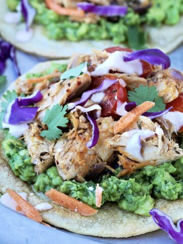 Tuna tostadas on a silver plate.