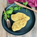 Crispy Baked Panko Chicken on a black plate.