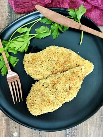 Crispy Baked Panko Chicken on a black plate.