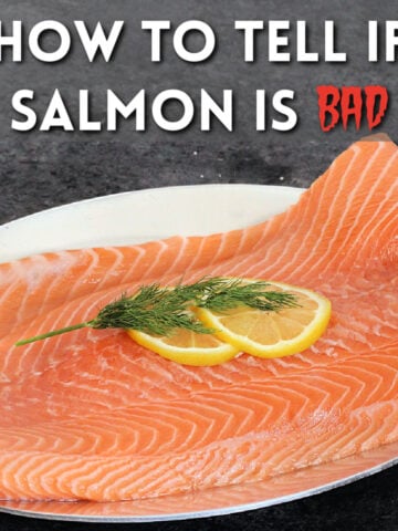 Piece of raw salmon on a plate.