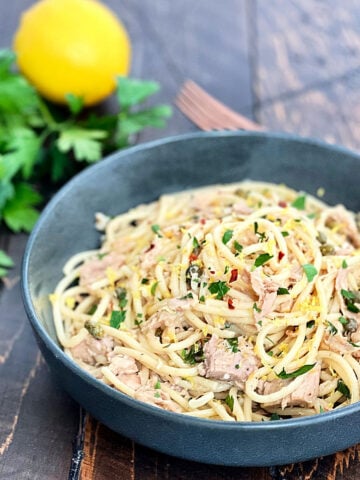 Tuna pasta in a dark gray bowl.