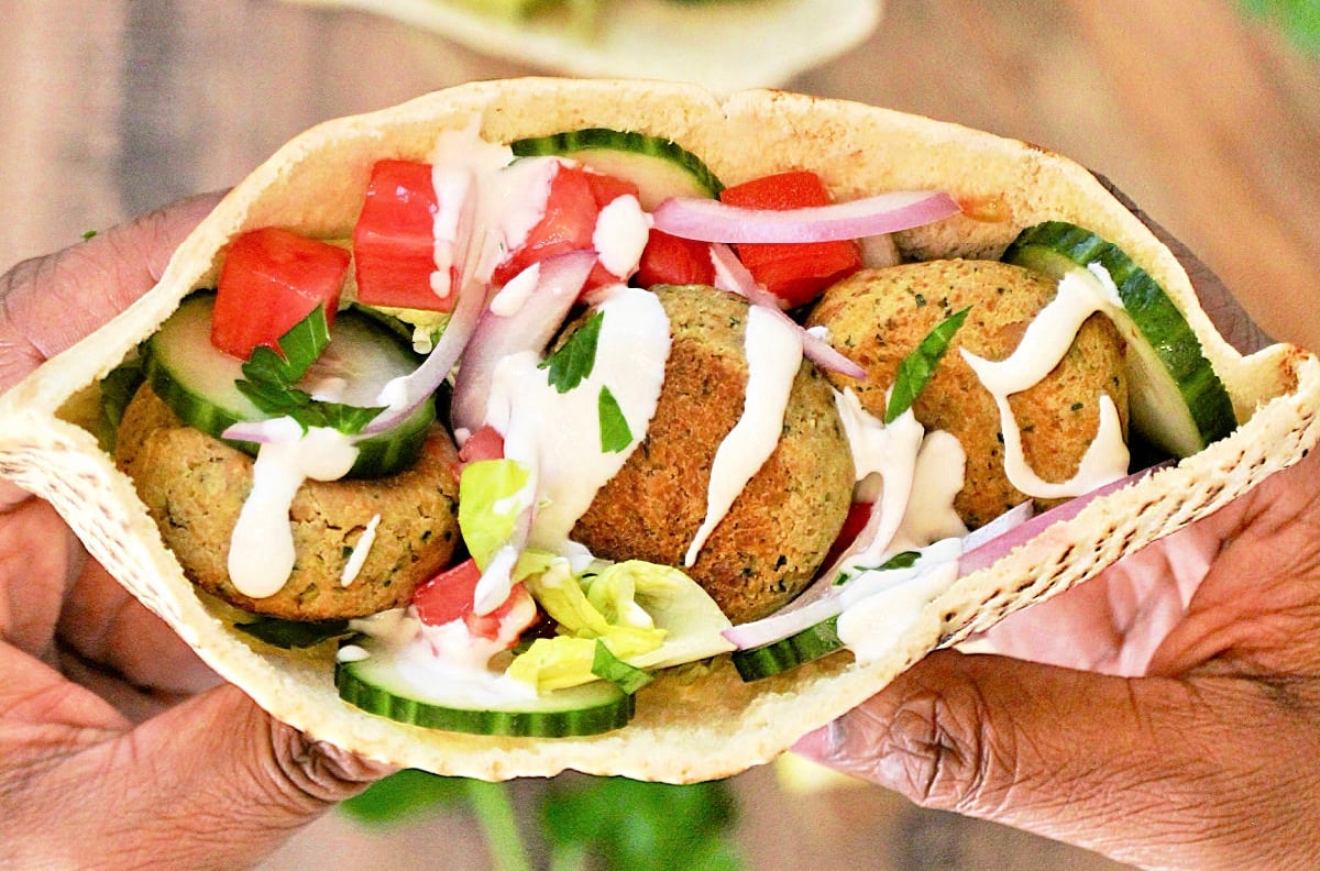Close up of a falafel pita sandwich.