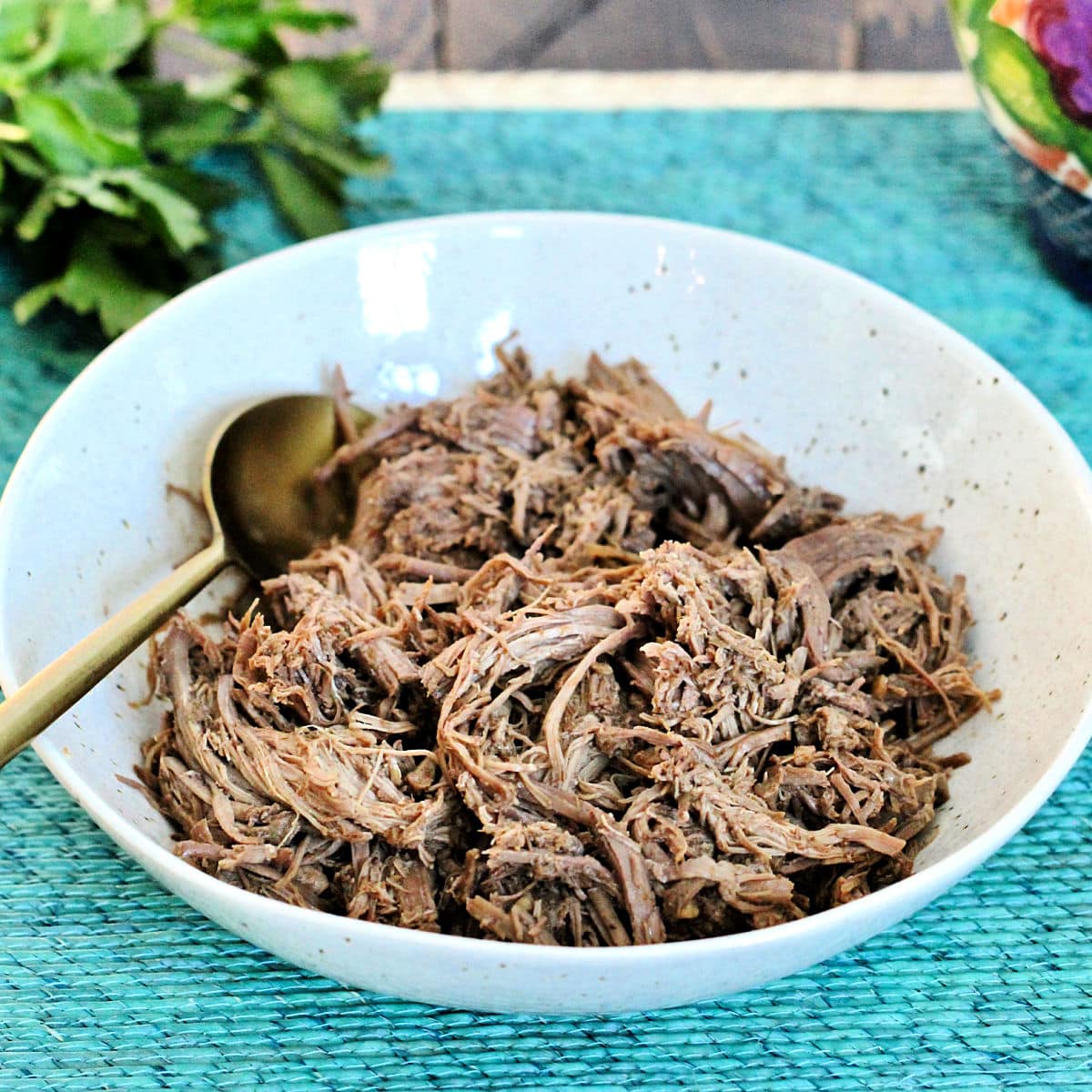 Shredded barbacoa in a bowl.