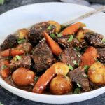 Classic Dutch Oven Beef Stew in a white bowl.