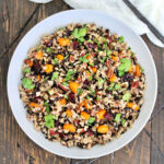Wild rice pilaf in a white bowl.