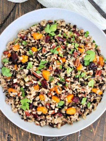 Wild rice pilaf in a white bowl.