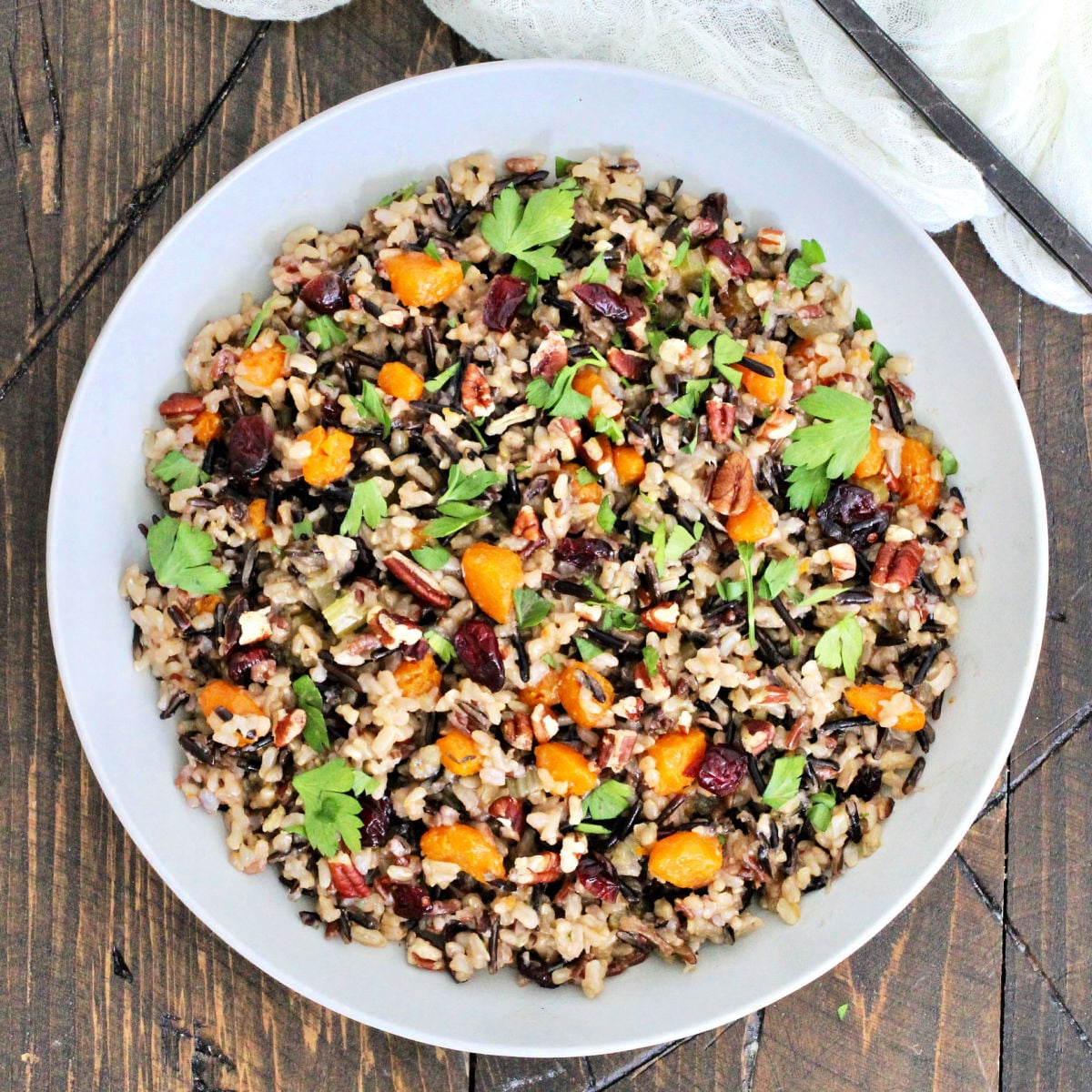 Wild rice pilaf in a white bowl.