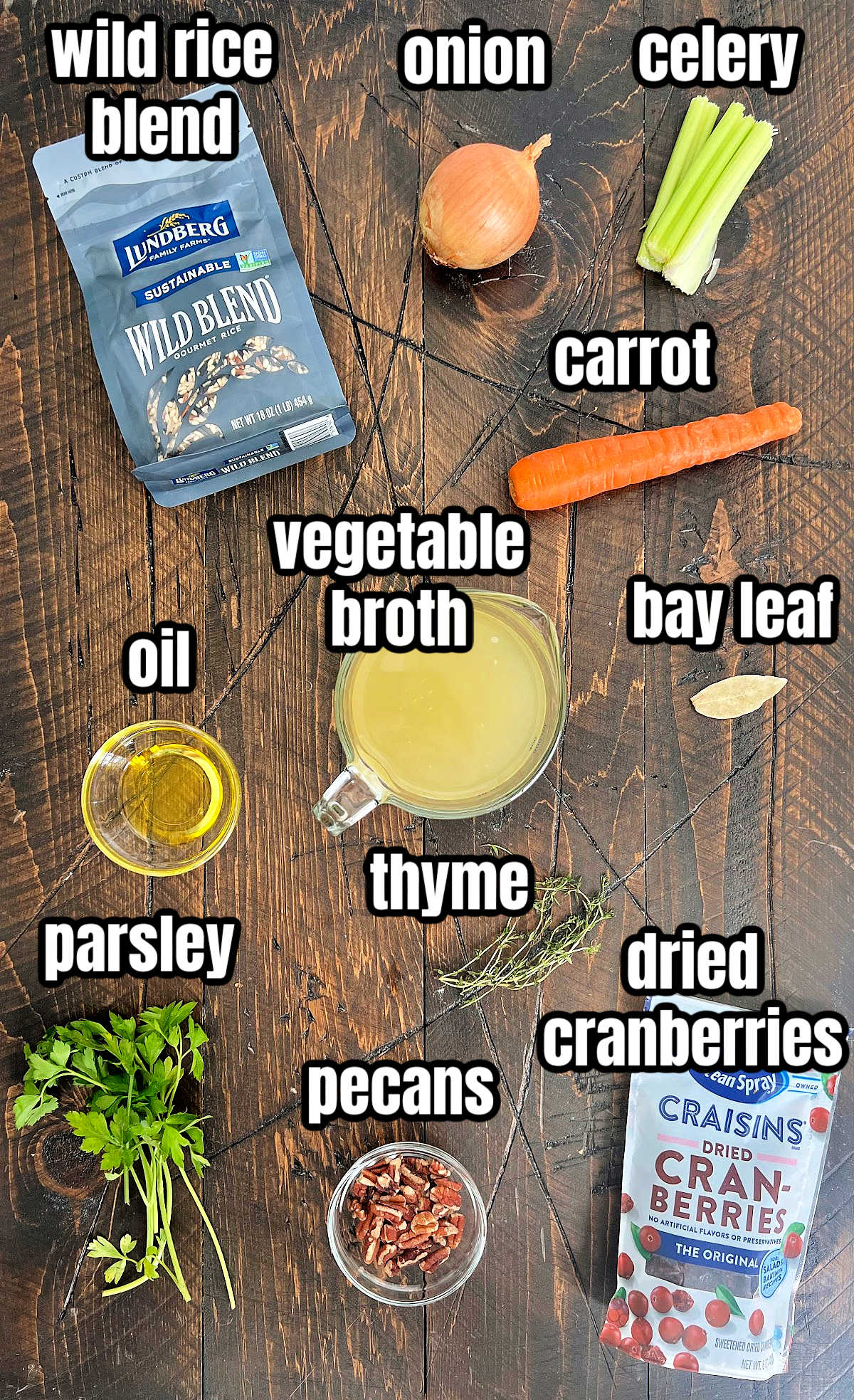Ingredients for wild rice pilaf on a wooden board. 