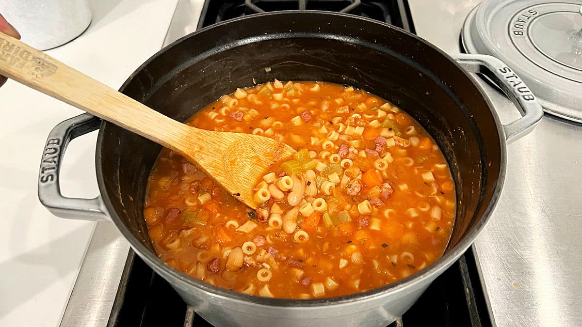 Pasta e fagioli soup in a pot on the stove.